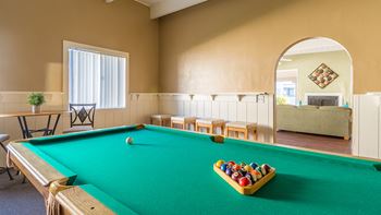 Riverstone clubhouse with pool table and lounge area